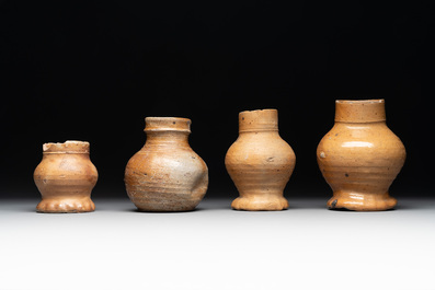 A collection of 13 German stoneware jugs, 15th C. and later