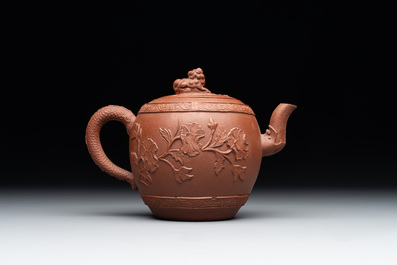 A Chinese Yixing stoneware teapot with relief design, Kangxi