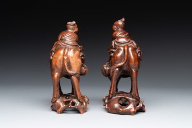 A pair of Chinese carved bamboo groups of a boy riding a buffalo, 19/20th C.