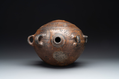 Five stoneware jugs or pilgrim flasks, including a Raeren example with armorial design, 16/17th C. and later