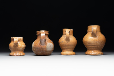 A collection of 13 German stoneware jugs, 15th C. and later