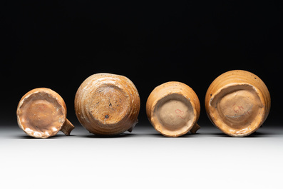 A collection of 13 German stoneware jugs, 15th C. and later