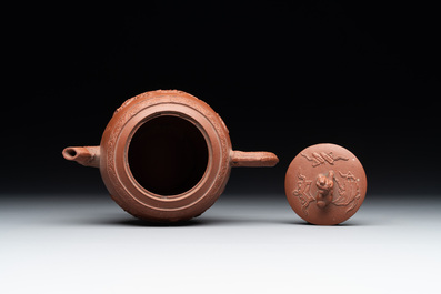 A Chinese Yixing stoneware teapot with relief design, Kangxi