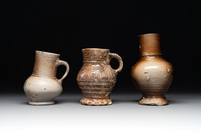 A collection of 13 German stoneware jugs, 15th C. and later