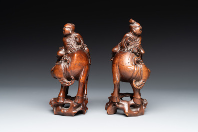 A pair of Chinese carved bamboo groups of a boy riding a buffalo, 19/20th C.