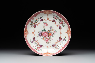 A Chinese famille rose 'Lowestoft' teapot, a plate, three cups and nine saucers, Qianlong