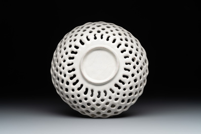 A reticulated Italian blue, white and yellow 'bird' bowl, Italy, Faenza or Deruta, 17th C.