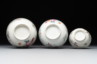 A Chinese famille rose 'Lowestoft' teapot, a plate, three cups and nine saucers, Qianlong
