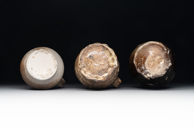 A collection of 13 German stoneware jugs, 15th C. and later