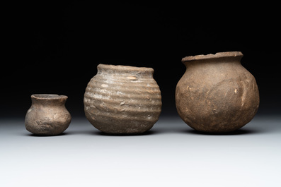 A collection of 9 German proto stoneware jugs and vessels, 14th C.