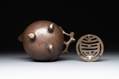 A Chinese bronze camel-form paperweight and a peach-shaped covered censer, 19th C.