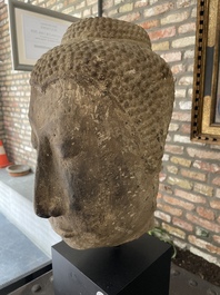 A Thai sandstone head of Buddha, possibly Ayutthaya period, 14/15th C.