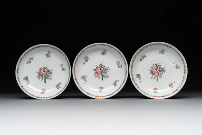 A Chinese famille rose 'Lowestoft' teapot, a plate, three cups and nine saucers, Qianlong