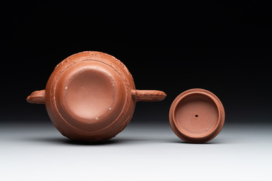 A Chinese Yixing stoneware teapot with relief design, Kangxi