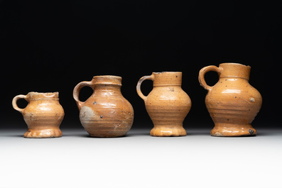 A collection of 13 German stoneware jugs, 15th C. and later