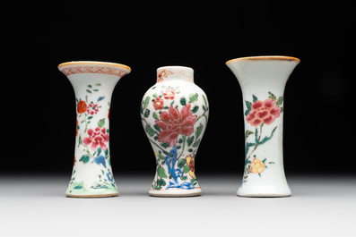 A Chinese famille rose tea caddy, two covered milk jugs and three vases, Yongzheng/Qianlong
