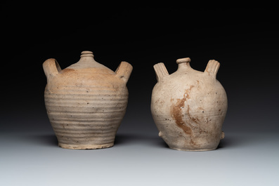 Five stoneware jugs or pilgrim flasks, including a Raeren example with armorial design, 16/17th C. and later