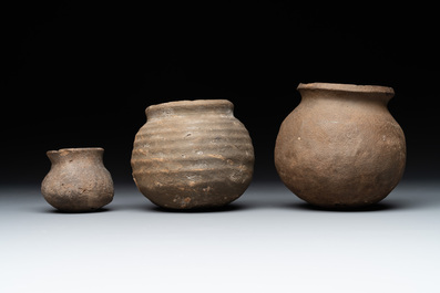 A collection of 9 German proto stoneware jugs and vessels, 14th C.