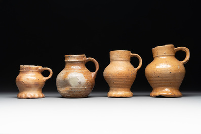 A collection of 13 German stoneware jugs, 15th C. and later