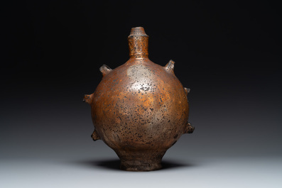 Five stoneware jugs or pilgrim flasks, including a Raeren example with armorial design, 16/17th C. and later