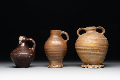 A collection of 13 German stoneware jugs, 15th C. and later