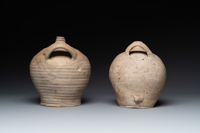 Five stoneware jugs or pilgrim flasks, including a Raeren example with armorial design, 16/17th C. and later