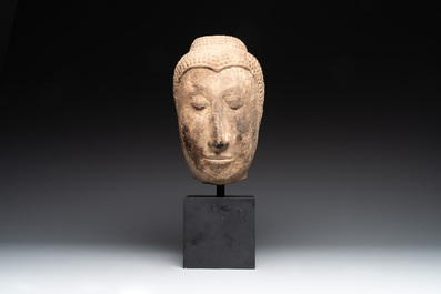 A Thai sandstone head of Buddha, possibly Ayutthaya period, 14/15th C.