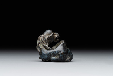 A Chinese bronze camel-form paperweight and a peach-shaped covered censer, 19th C.