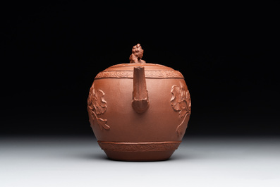 A Chinese Yixing stoneware teapot with relief design, Kangxi