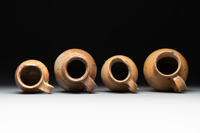 A collection of 13 German stoneware jugs, 15th C. and later