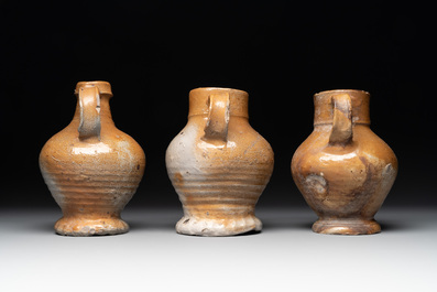 A collection of 13 German stoneware jugs, 15th C. and later