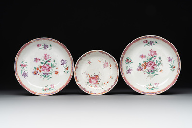 A Chinese famille rose 'Lowestoft' teapot, a plate, three cups and nine saucers, Qianlong
