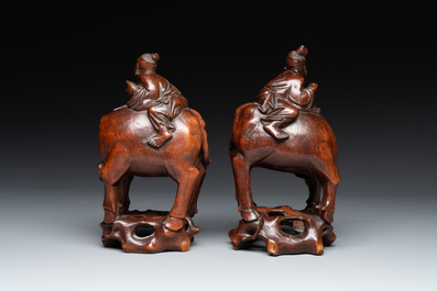 A pair of Chinese carved bamboo groups of a boy riding a buffalo, 19/20th C.