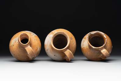 A collection of 13 German stoneware jugs, 15th C. and later