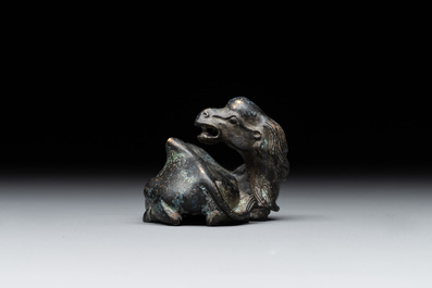A Chinese bronze camel-form paperweight and a peach-shaped covered censer, 19th C.