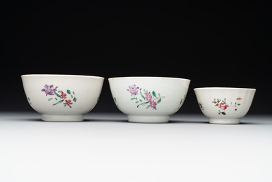 A Chinese famille rose 'Lowestoft' teapot, a plate, three cups and nine saucers, Qianlong