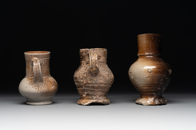 A collection of 13 German stoneware jugs, 15th C. and later