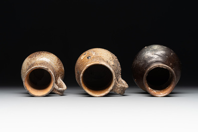 A collection of 13 German stoneware jugs, 15th C. and later