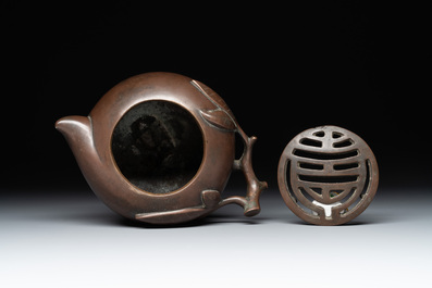A Chinese bronze camel-form paperweight and a peach-shaped covered censer, 19th C.