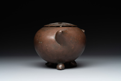 A Chinese bronze camel-form paperweight and a peach-shaped covered censer, 19th C.