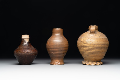 A collection of 13 German stoneware jugs, 15th C. and later