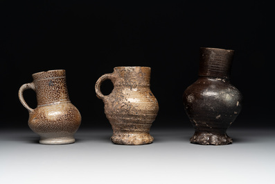 A collection of 13 German stoneware jugs, 15th C. and later