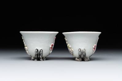 A pair of Chinese Dehua blanc de Chine relief-decorated famille rose 'prunus' cups, 19th C.