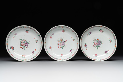 A Chinese famille rose 'Lowestoft' teapot, a plate, three cups and nine saucers, Qianlong