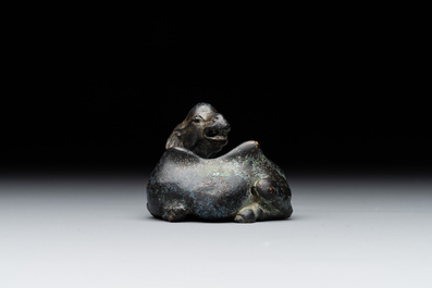 A Chinese bronze camel-form paperweight and a peach-shaped covered censer, 19th C.