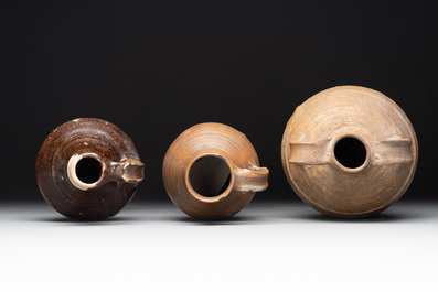 A collection of 13 German stoneware jugs, 15th C. and later