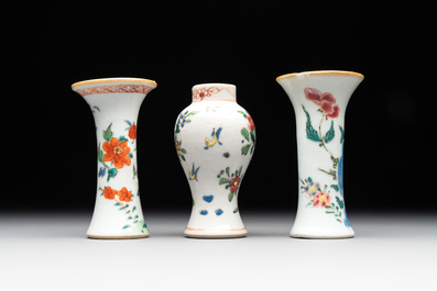 A Chinese famille rose tea caddy, two covered milk jugs and three vases, Yongzheng/Qianlong