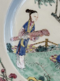 A pair of Chinese famille rose 'ladies in a garden' plates, Yongzheng