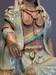 A Chinese Longquan celadon Guanyin, Ming or later