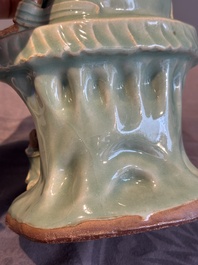 A Chinese Longquan celadon Guanyin, Ming or later